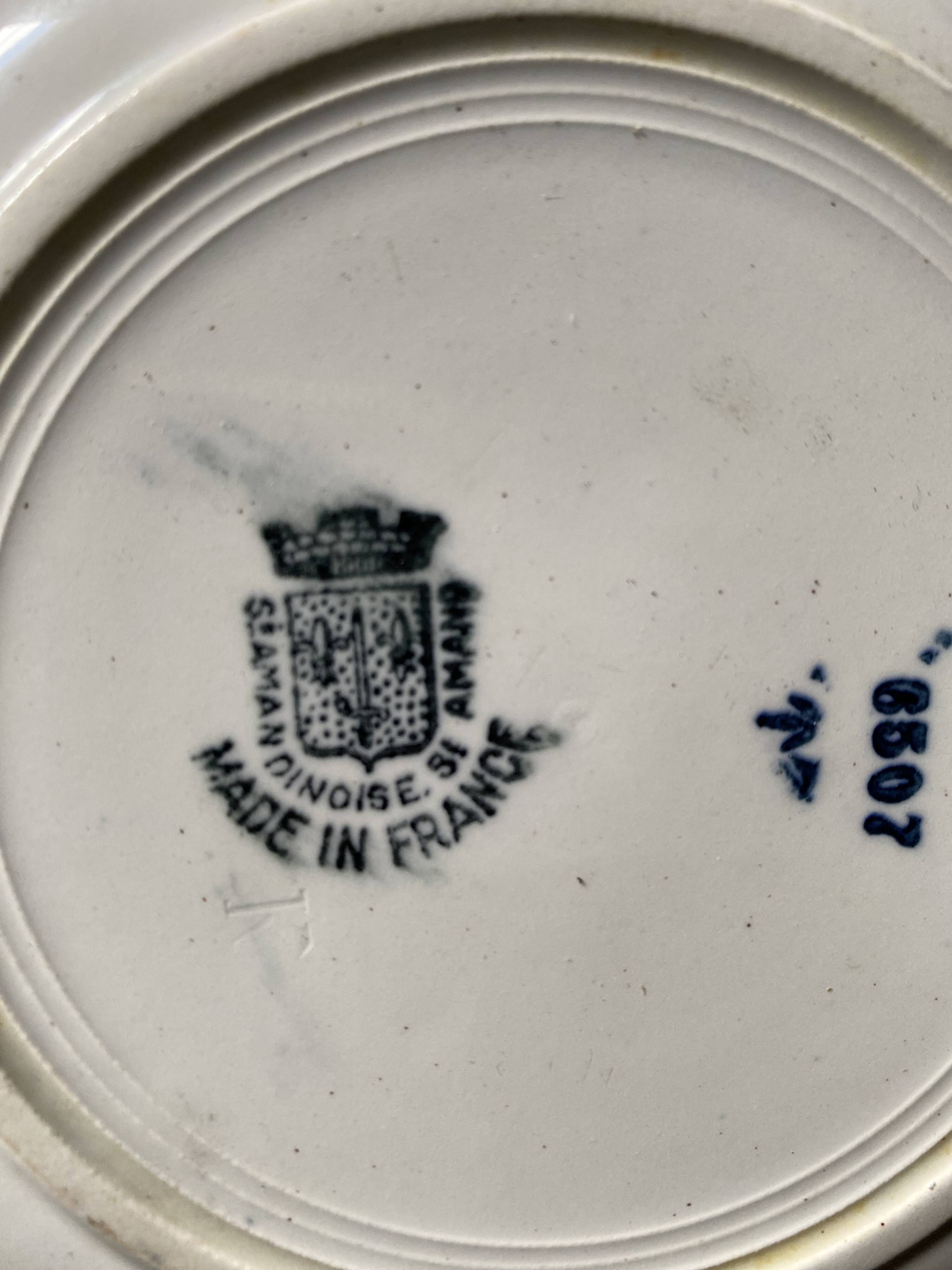 3 dessert plates stamped in art deco style.