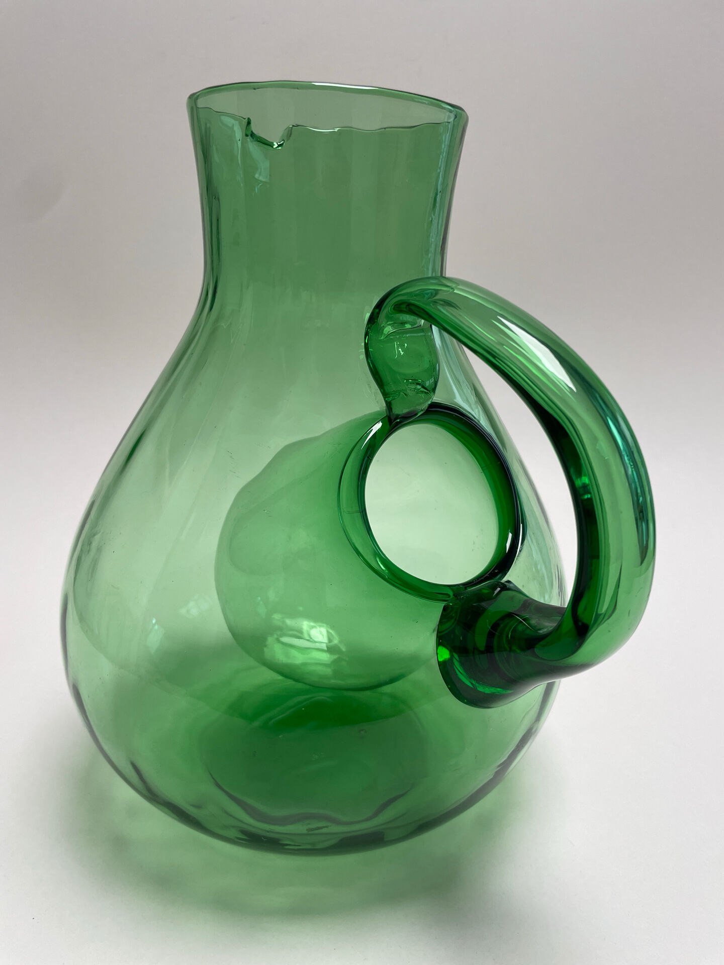 Large green glass cooling jug
