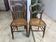 Pair of N2 antique caned and wooden chairs from the 1900s.