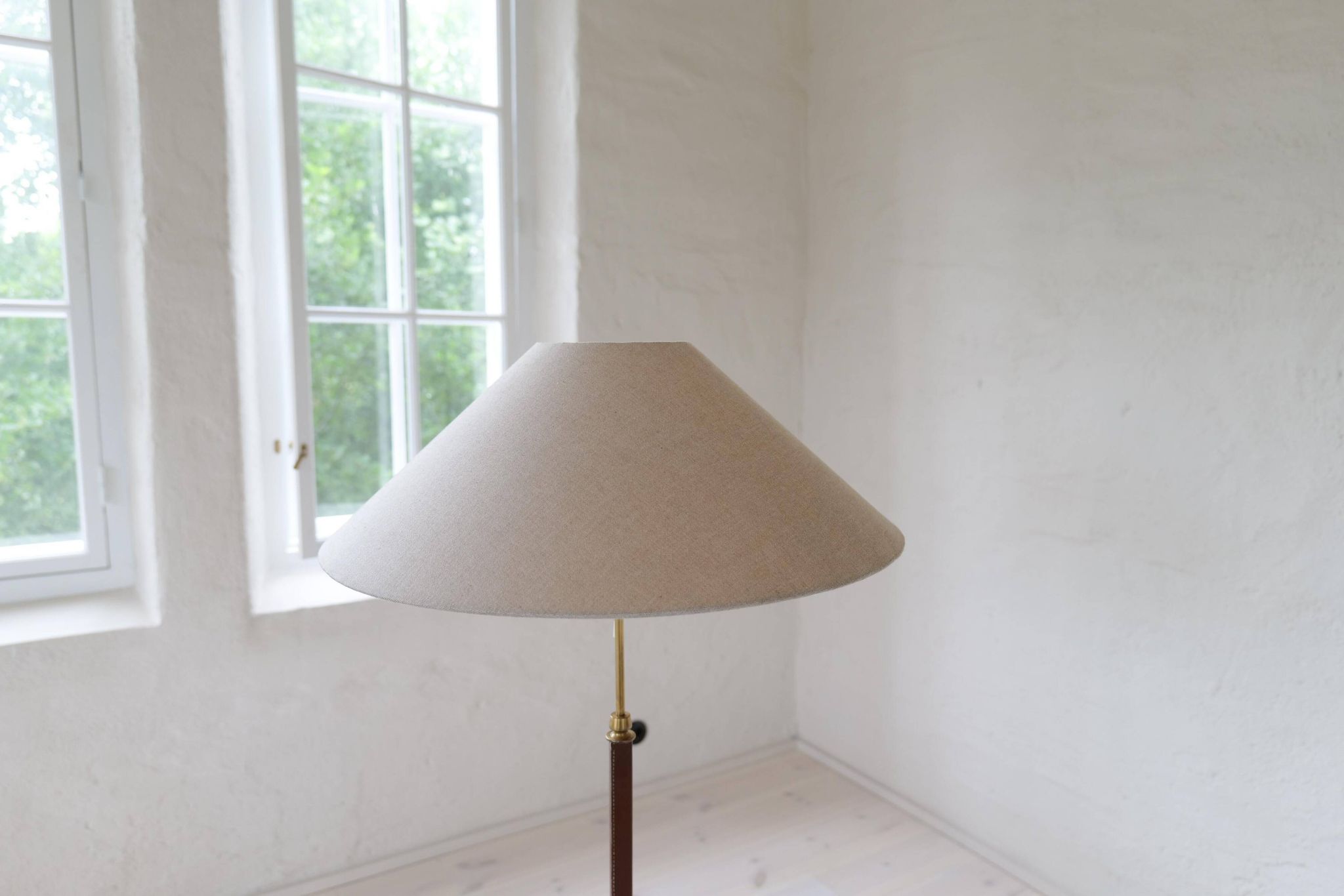 Mid-century brown leather and patinated brass floor lamp by Falkenbergs Belysning, Sweden, 1960s.