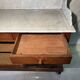 Antique wood and marble kitchen sideboard with carved backsplash