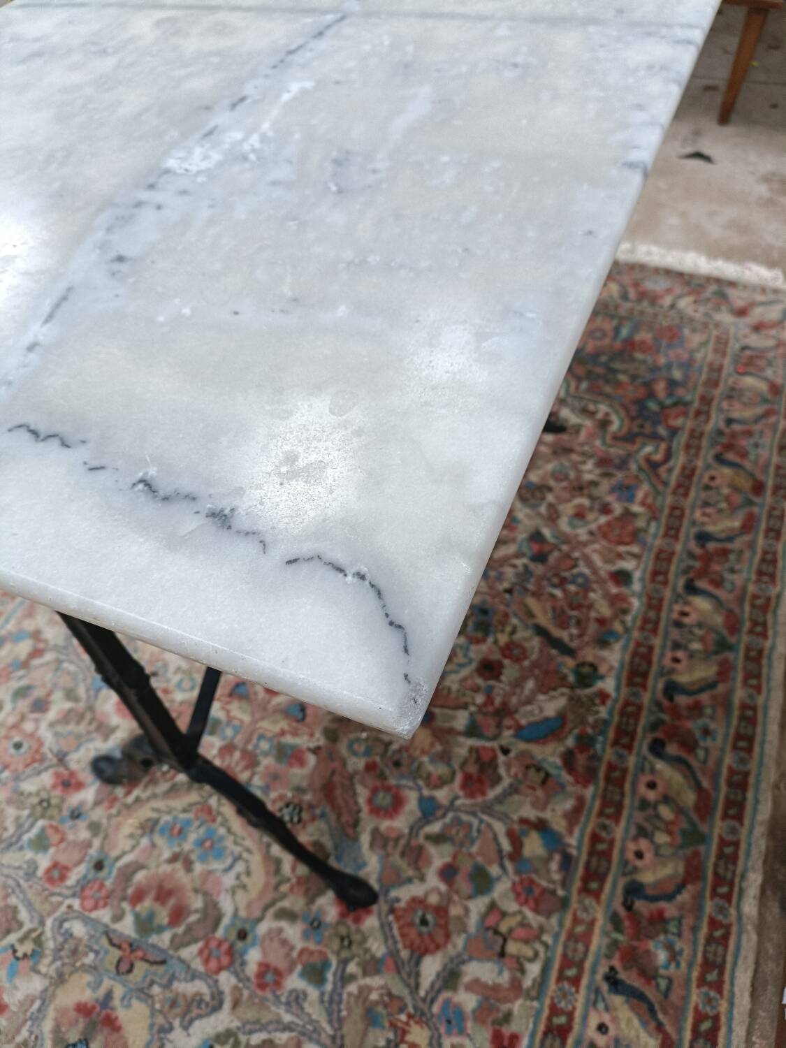 Bistro table with cast iron legs and marble top