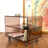 Smoked Plexiglas coffee table on wheels -