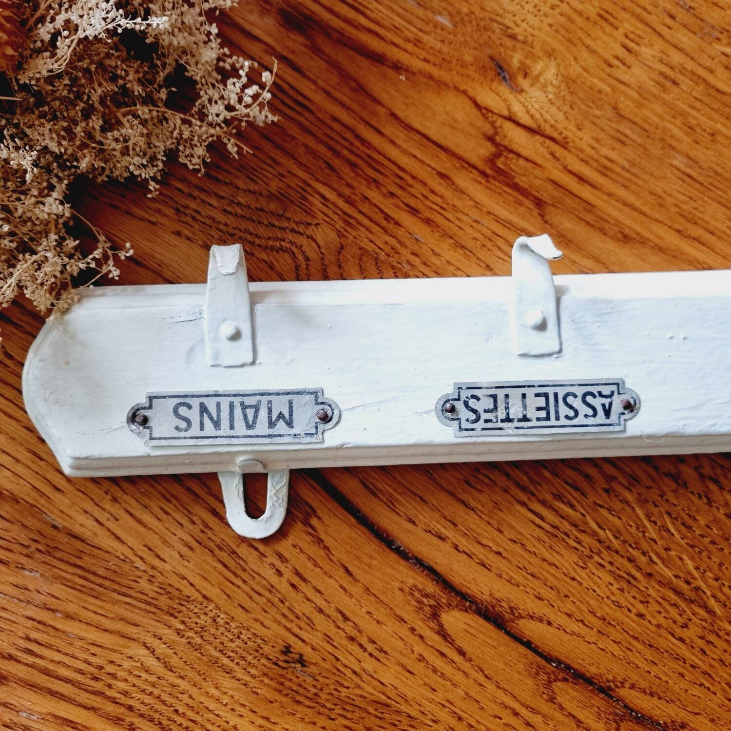 Old coat hook tea towel holder