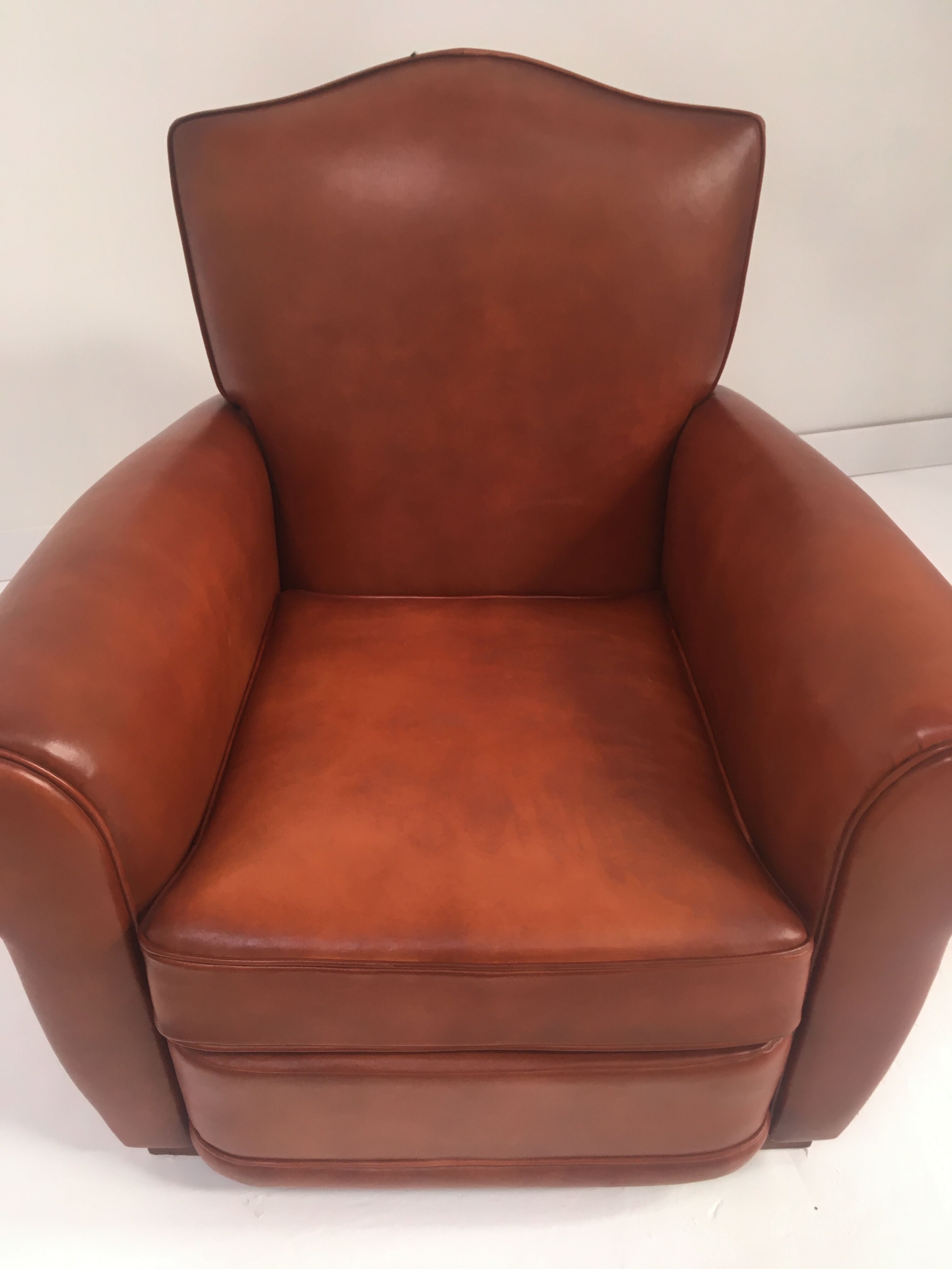Large club chair in cognac leather