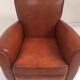 Large club chair in cognac leather