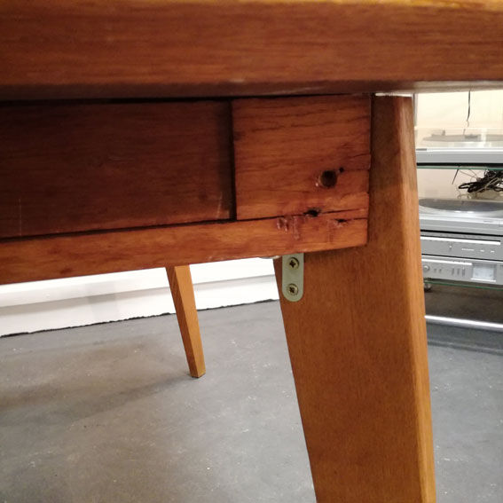 Dining table with compass feet