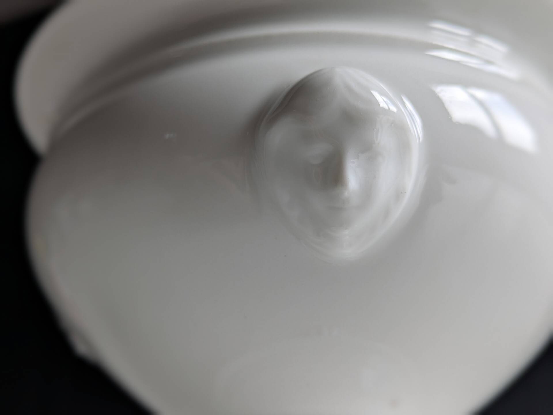 White porcelain confiturier with lion paws and masks. 19th century.