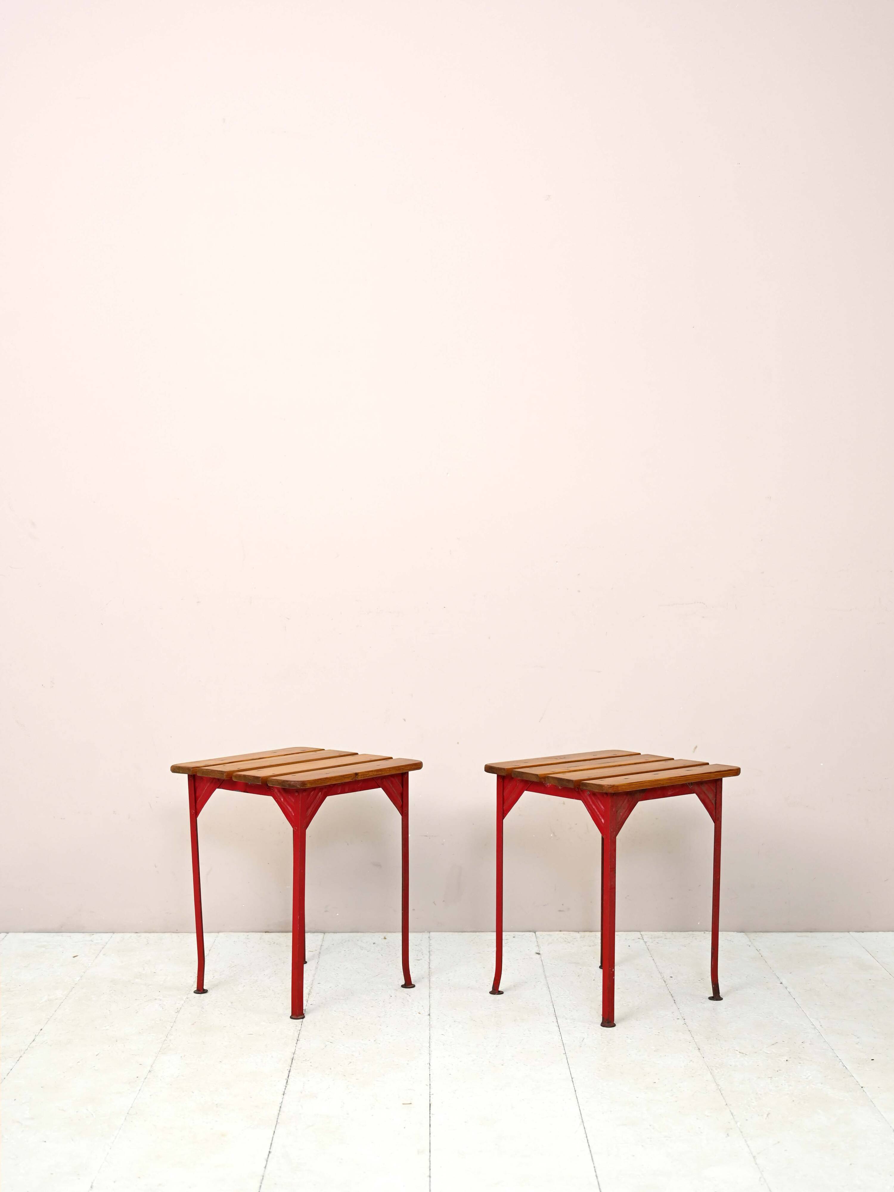 Pair of red metal and wood stools
