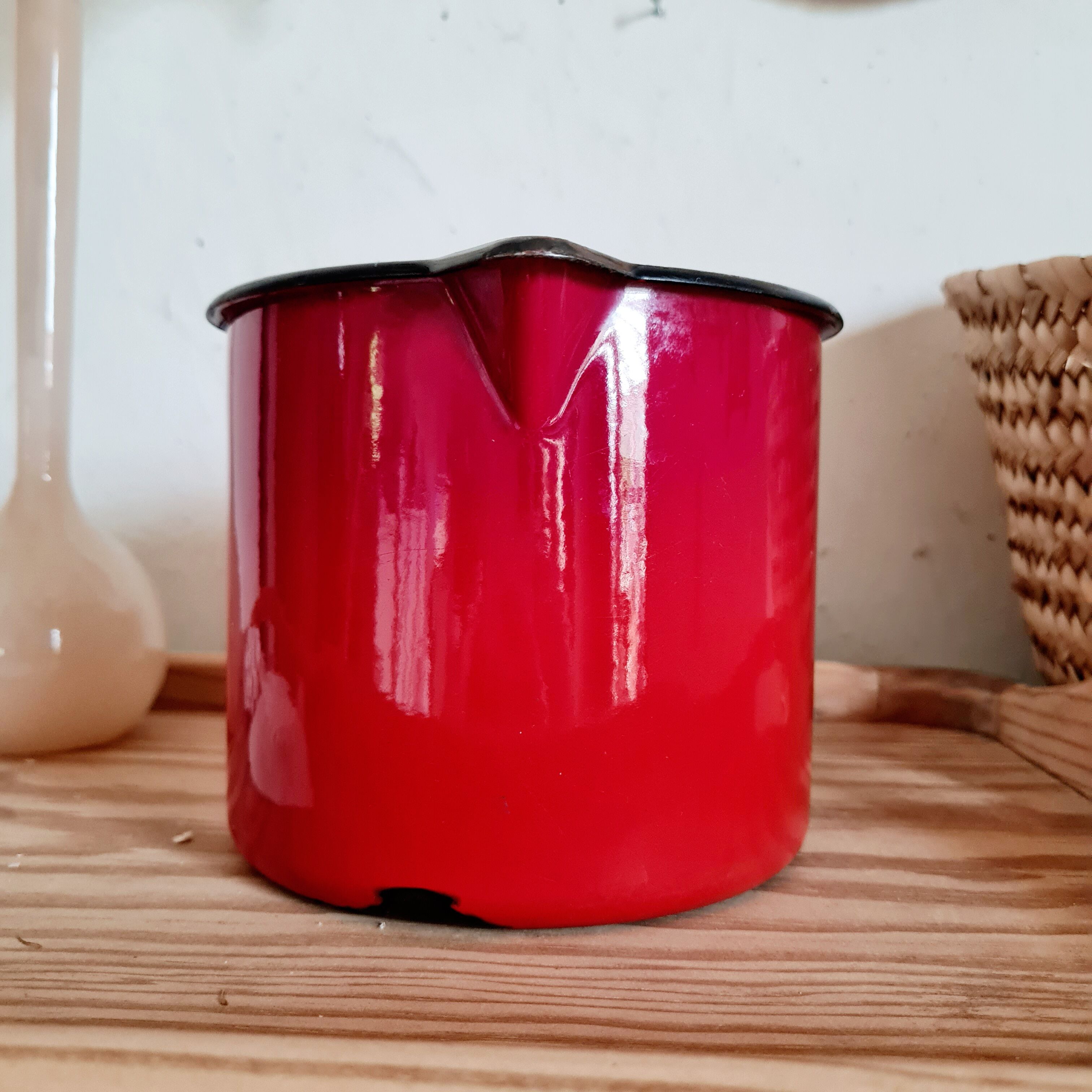 Pitcher vase in red enamelled sheet metal