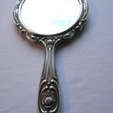 Art Nouveau hand-facing, mirror in repulsed silver frame, rose decoration 14x27cm