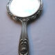 Face à main art nouveau miroir dans armature argent repoussé décor de roses 14x27cm