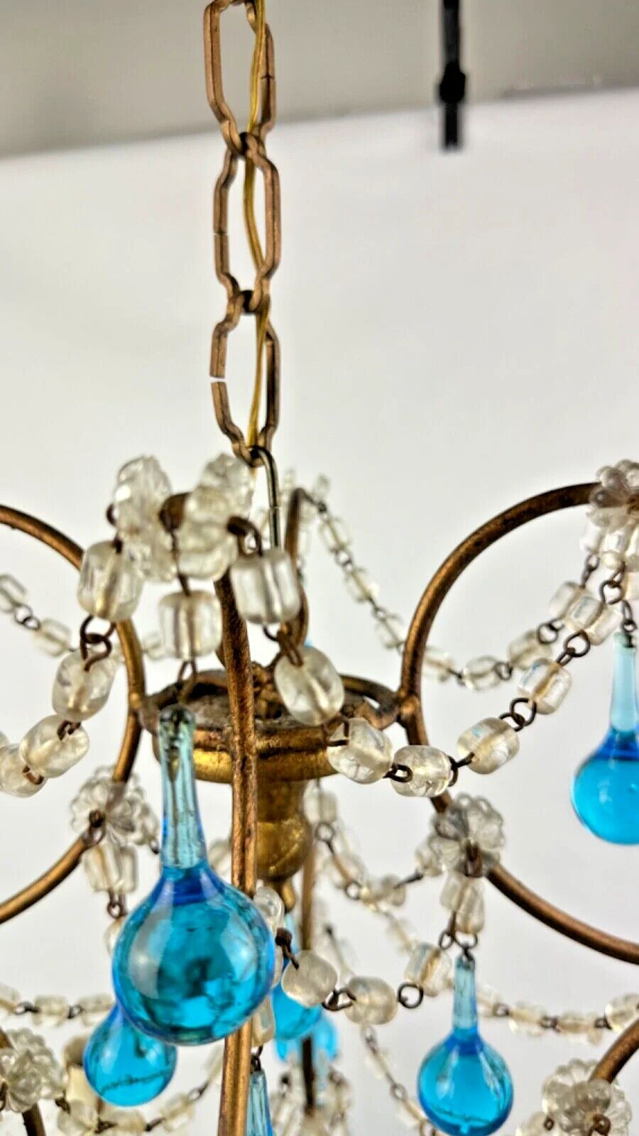 Italian chandelier with blue beads and gilded wood.