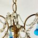 Italian chandelier with blue beads and gilded wood.