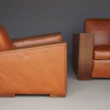Paire de fauteuils Art Déco en cuir. Années 40.