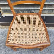 Antique wooden chair with cane seating