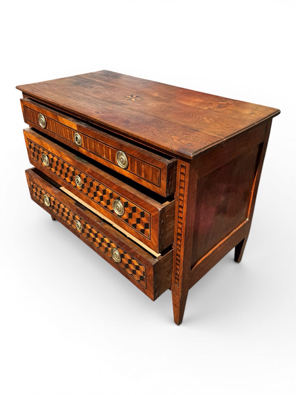 Louis XVI commode with marquetry featuring a design of precious wood cubes, 18th century.