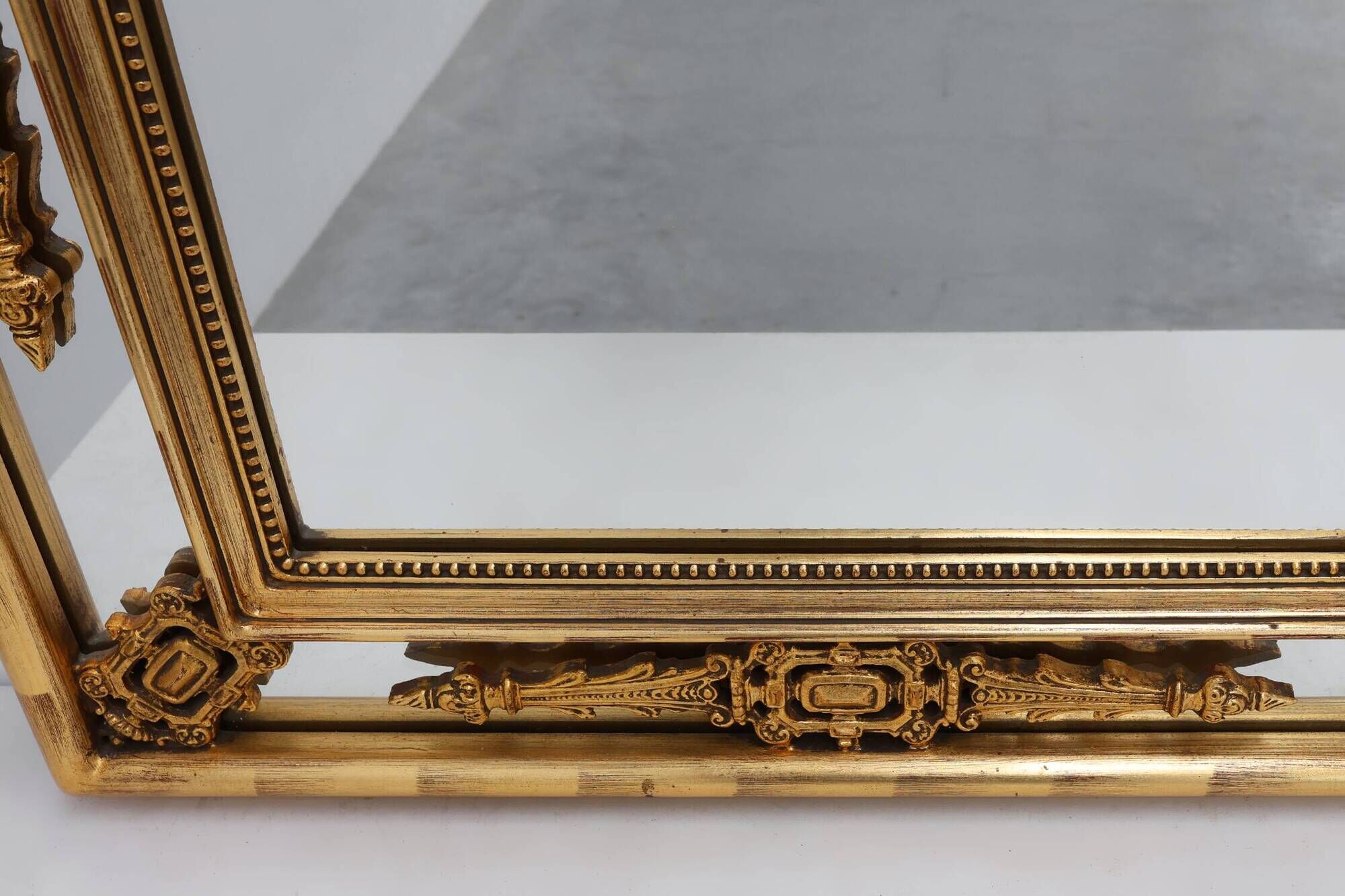 Louis XVI style gilt mirror with laurel wreath crest, Belgium, 20th century