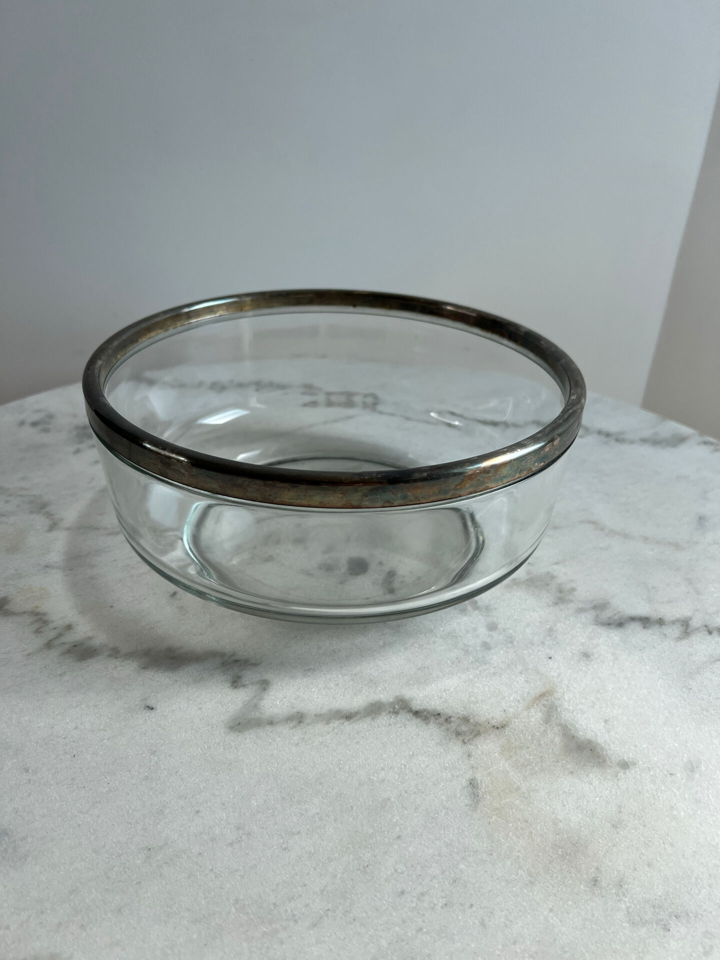 Glass and silver-plated metal salad bowl, silver rim.
