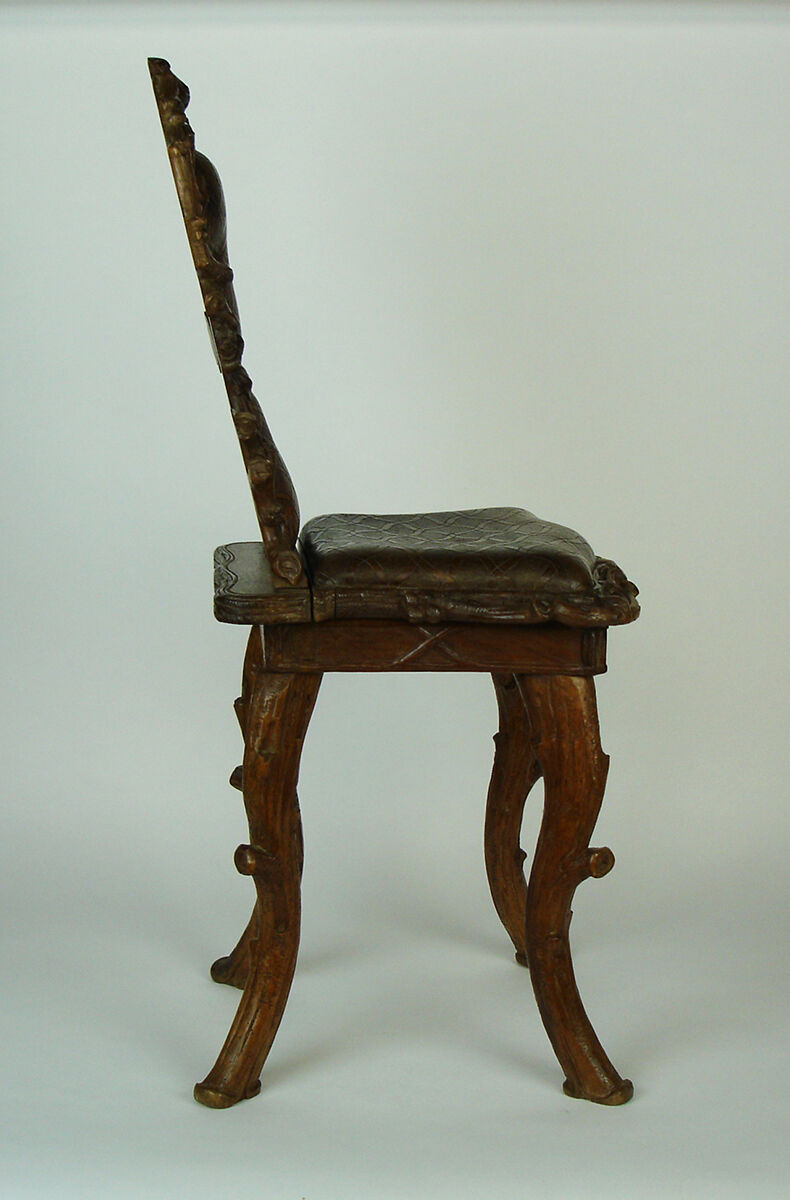 Sculpted chair in "black drill" style