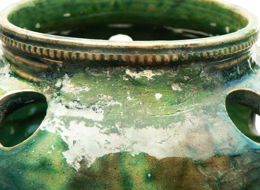 details on old bulb pot in glazed earthenware