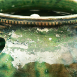 details on old bulb pot in glazed earthenware