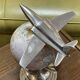 1960s terrestrial globe on a chrome stand with a plane flying over it.