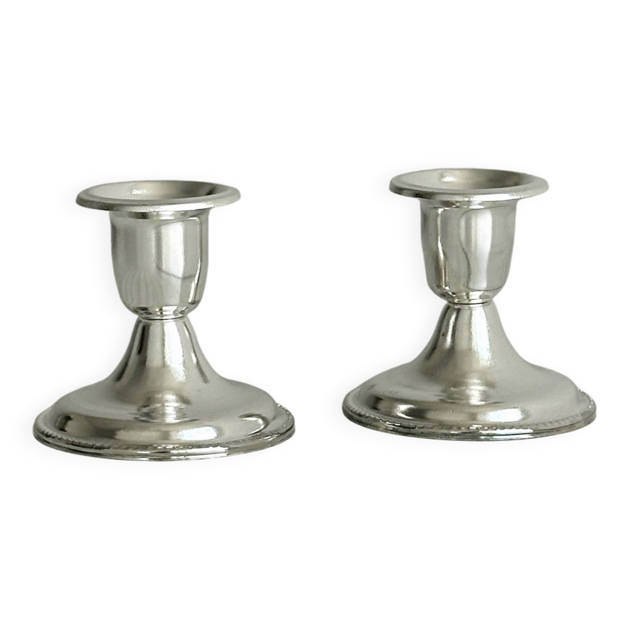 Pair of lightweight silver metal candlesticks