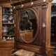 Porte-manteau de vestibule en noyer massif avec miroir ovale et patères en bronze