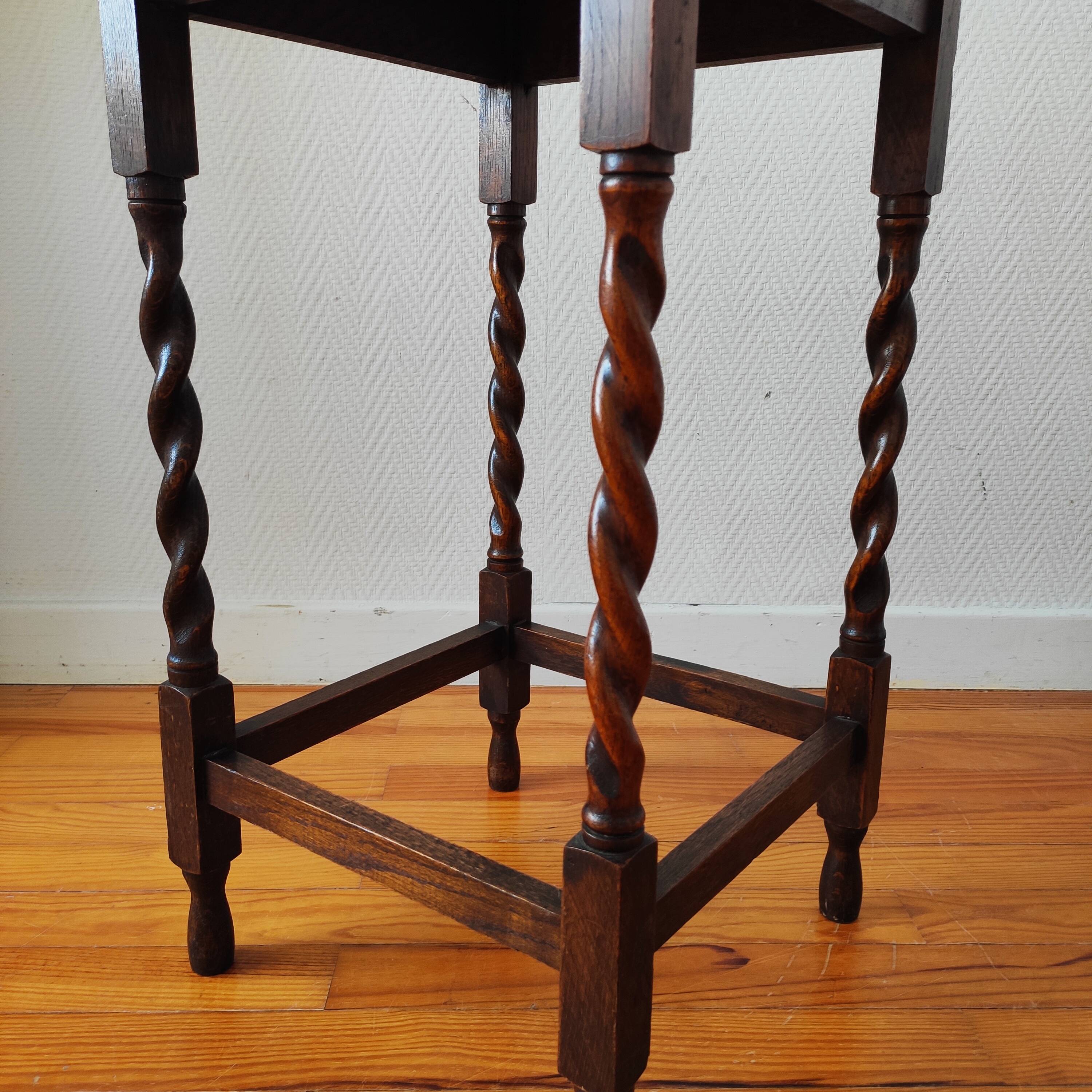 Antique solid oak side table with turned wooden legs.