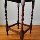 Antique solid oak side table with turned wooden legs.