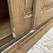 Large row of solid oak loom sliding doors