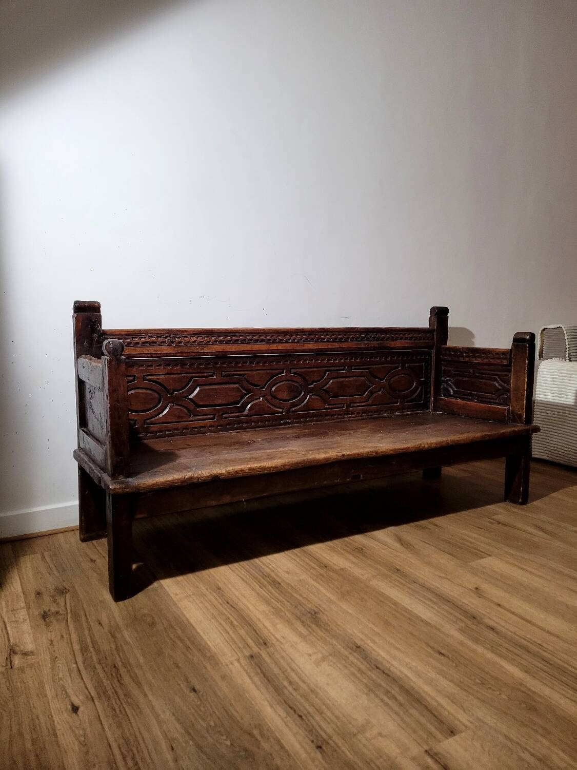 Antique carved solid wood bench from the early 20th century