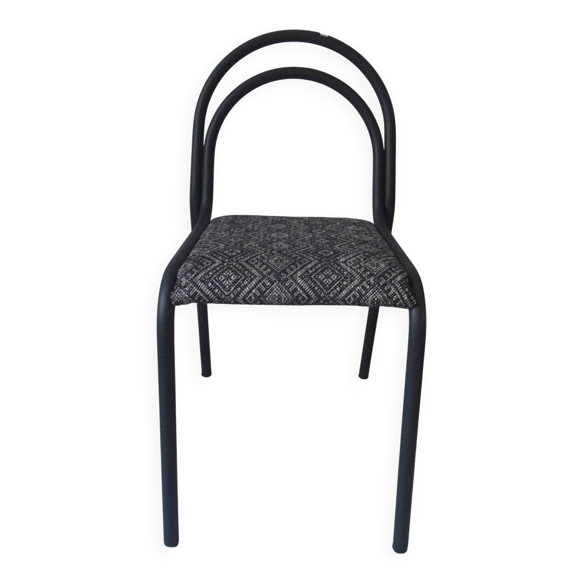 Industrial chair with a tubular metal frame in slate grey.