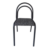 Industrial chair with a tubular metal frame in slate grey.