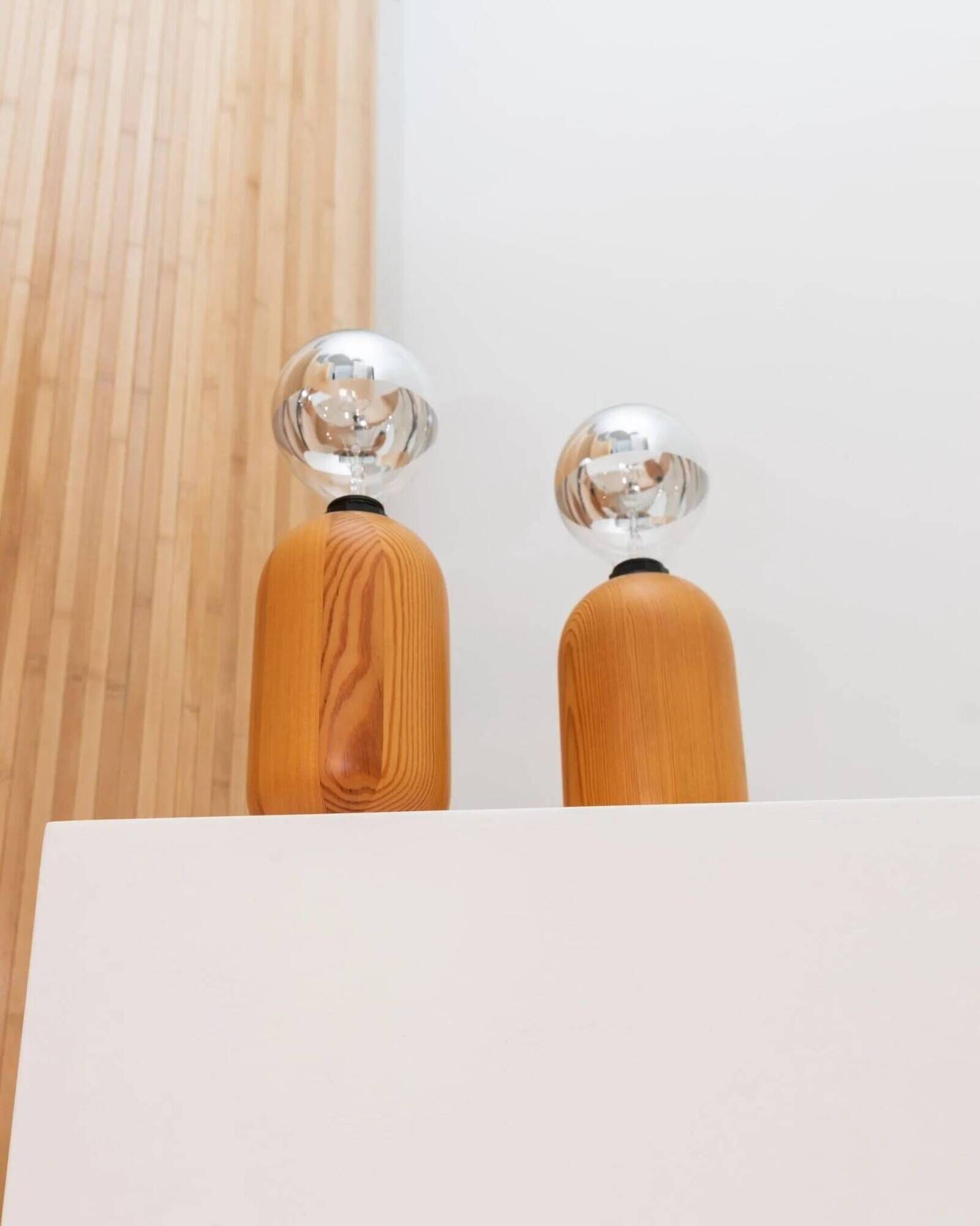 Pair of XXL Domus table lamps in marron wood with chrome globe bulbs