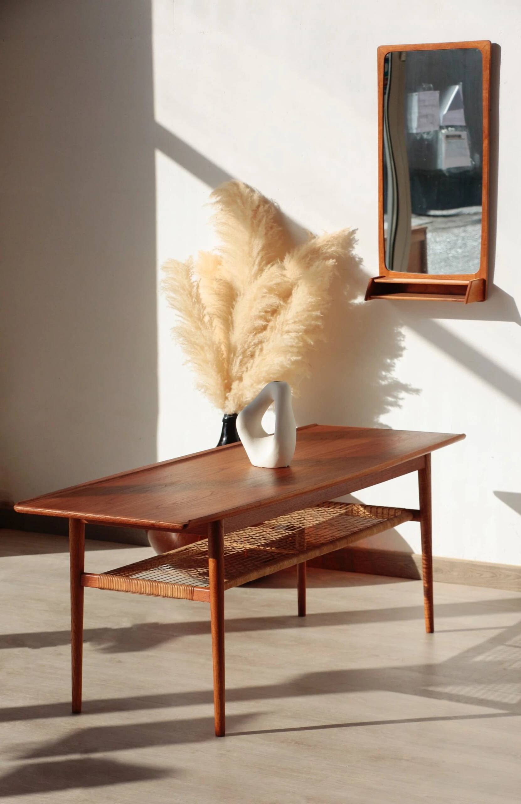 Vintage Scandinavian coffee table in teak and rattan – Danish design from the 1960s.