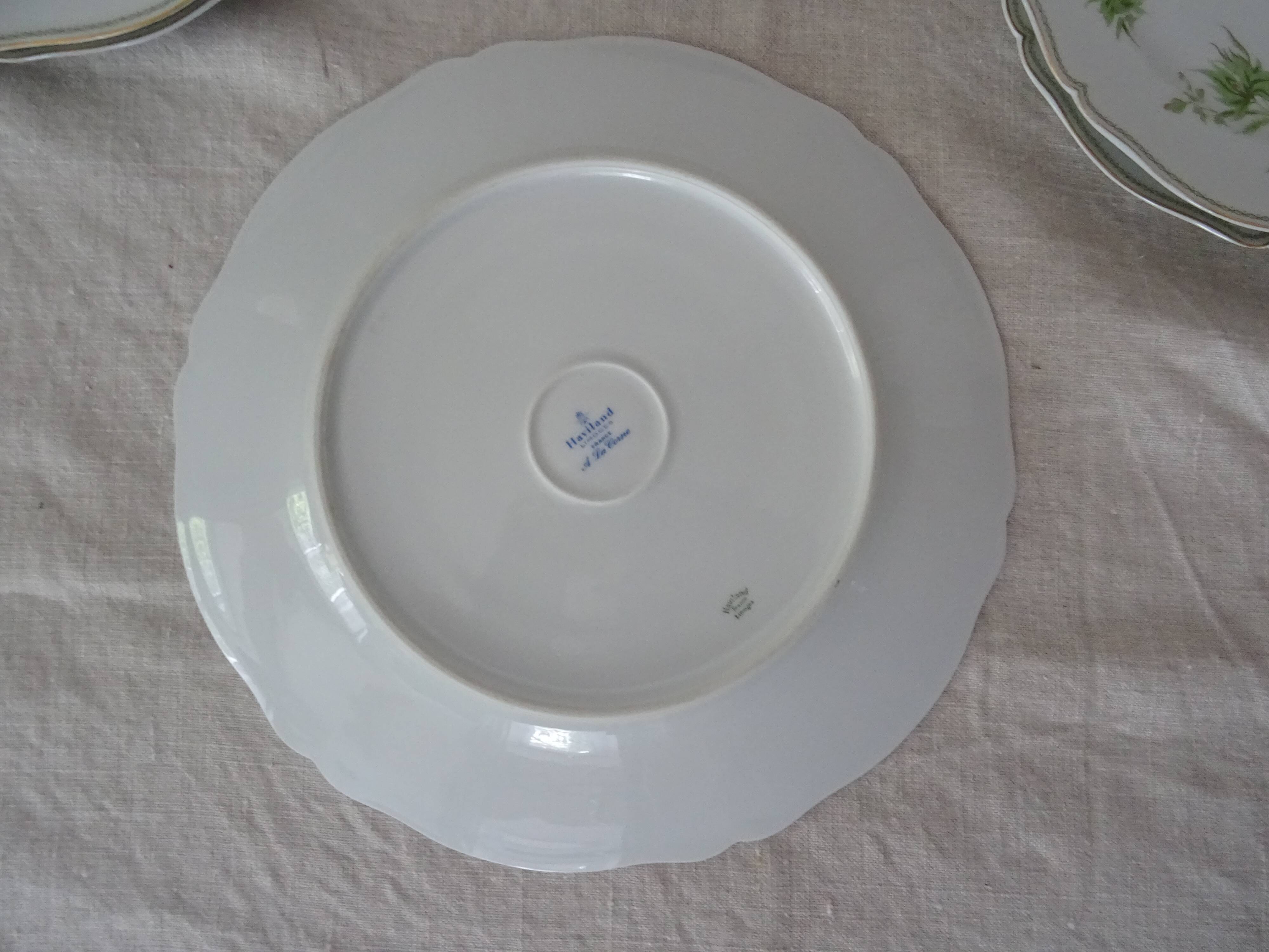 6 flat plates and 1 round dish haviland limoges with green and gold horn