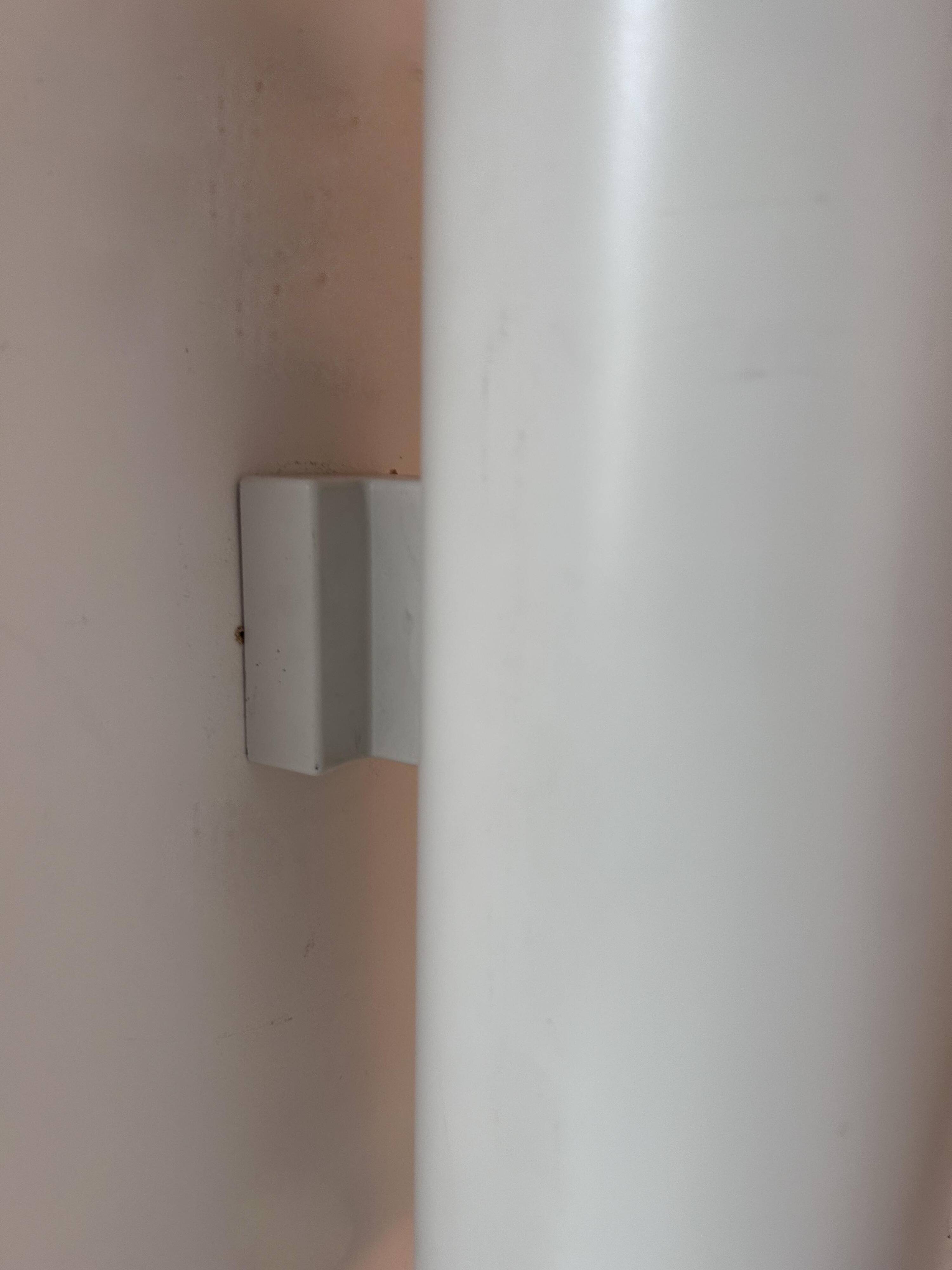 Pair of vintage cylindrical wall lights, matt white metal, Germany Erco 1976