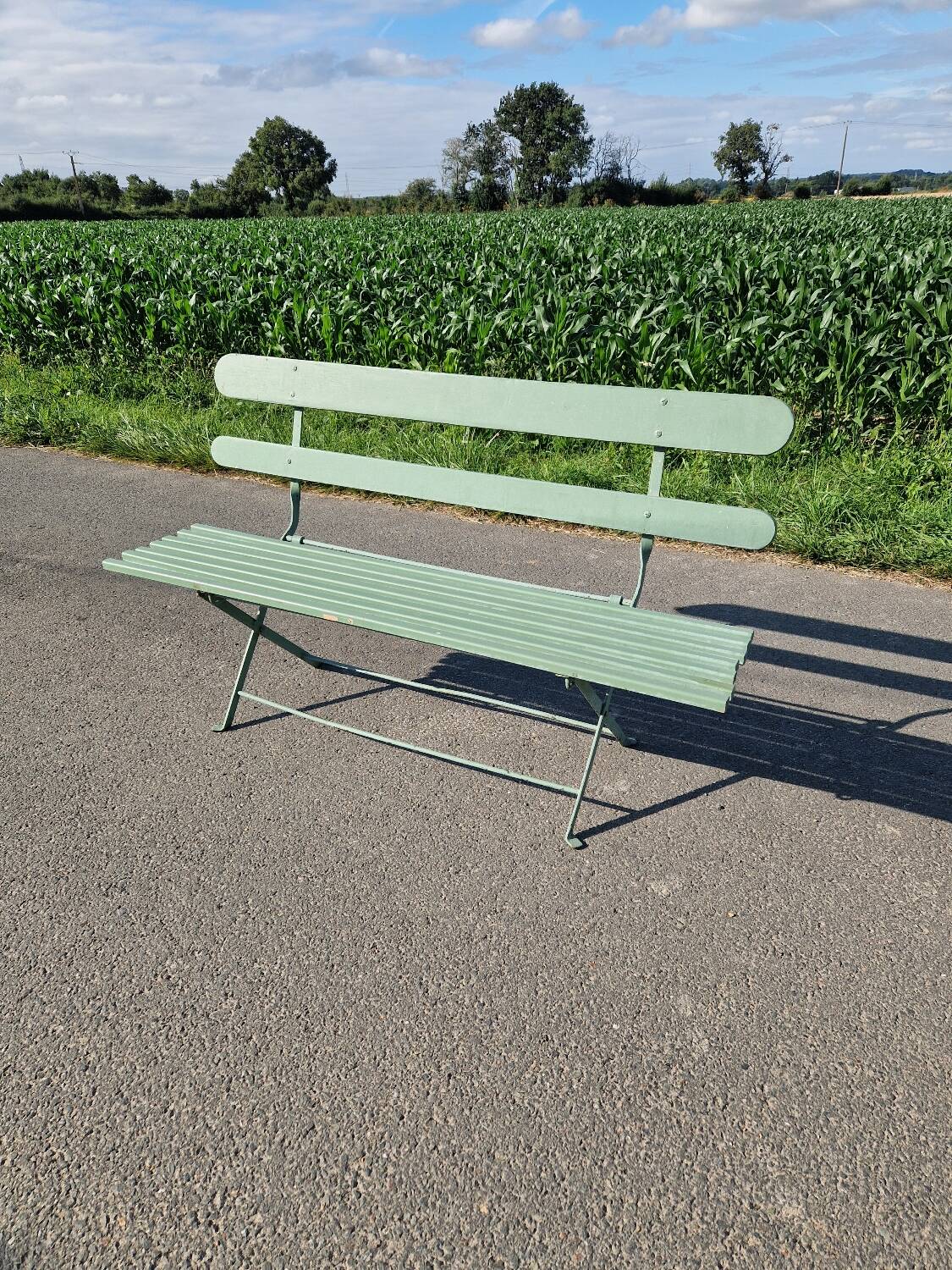 Ancien banc de jardin pliant en fer forgé vert