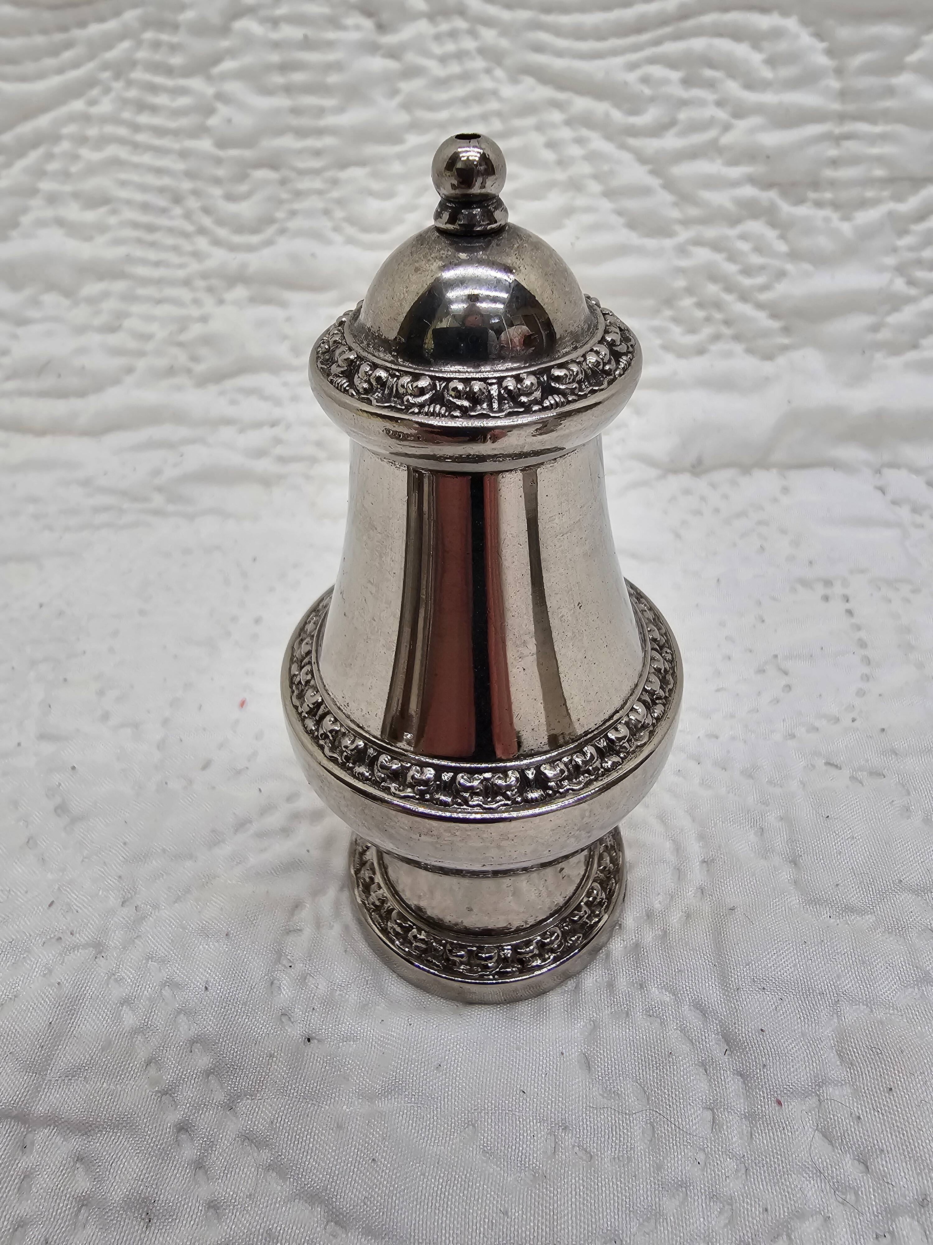Silver-plated salt and pepper shakers and egg cups
