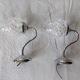 Pair of wall brackets in chromed metal and cut glass
