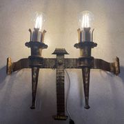 Spanish brutalist wall light in gilded wrought iron.