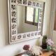 Large square ceramic mirror with floral decoration.