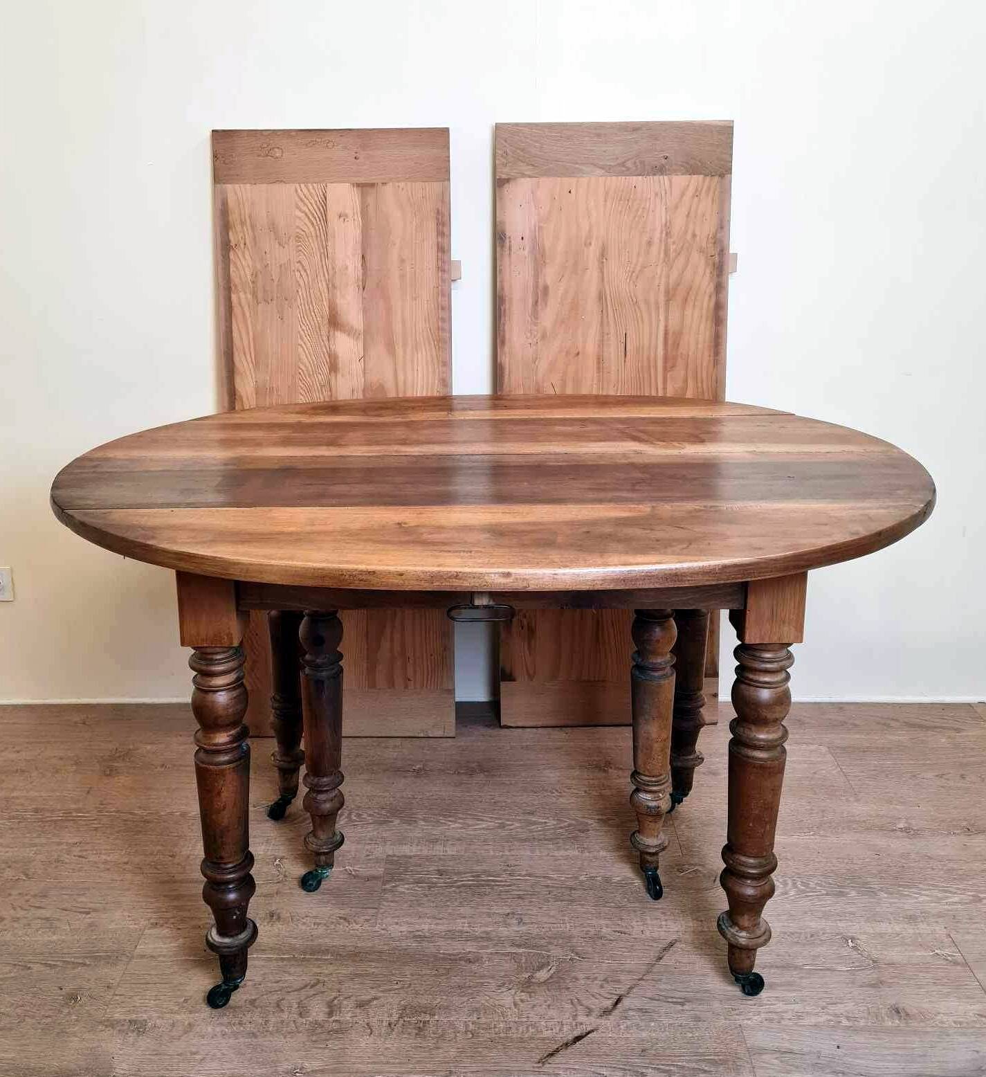 Louis Philippe period 6-legged extending table in solid walnut