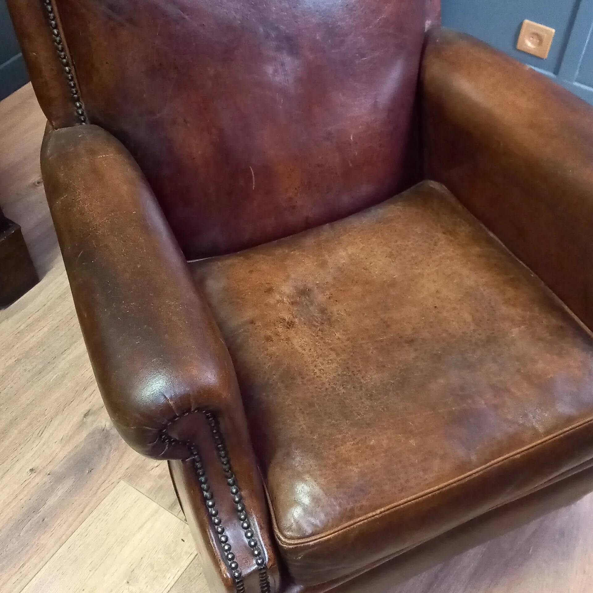 Club armchair in sheepskin in Art Deco style
