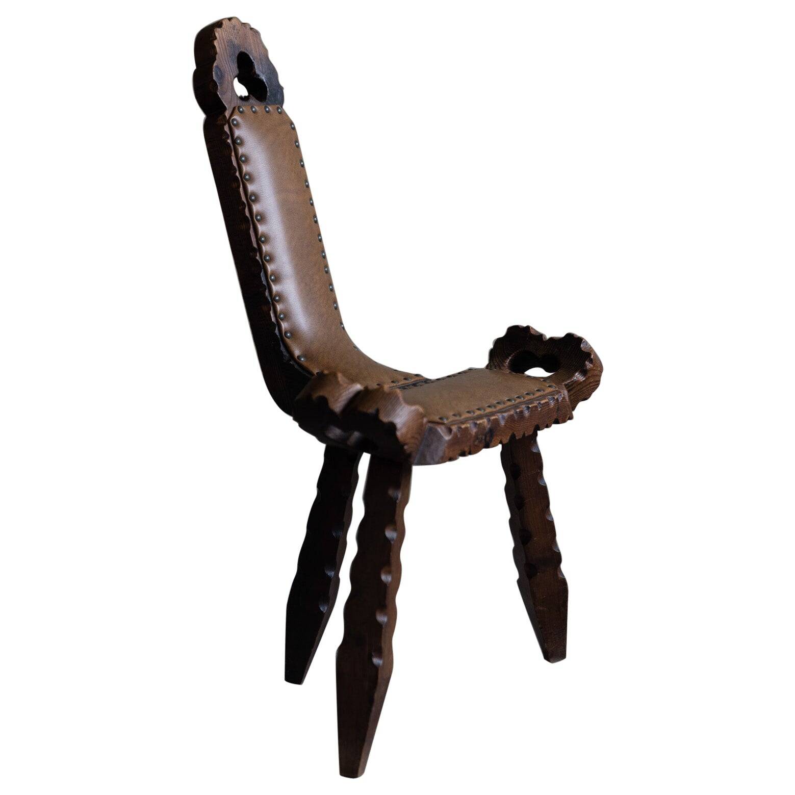 Carved wooden tripod chair with leather seat, Wabi Sabi, early 20th century.