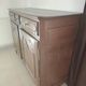 Two low antique buffets in carved solid oak with rosettes.
