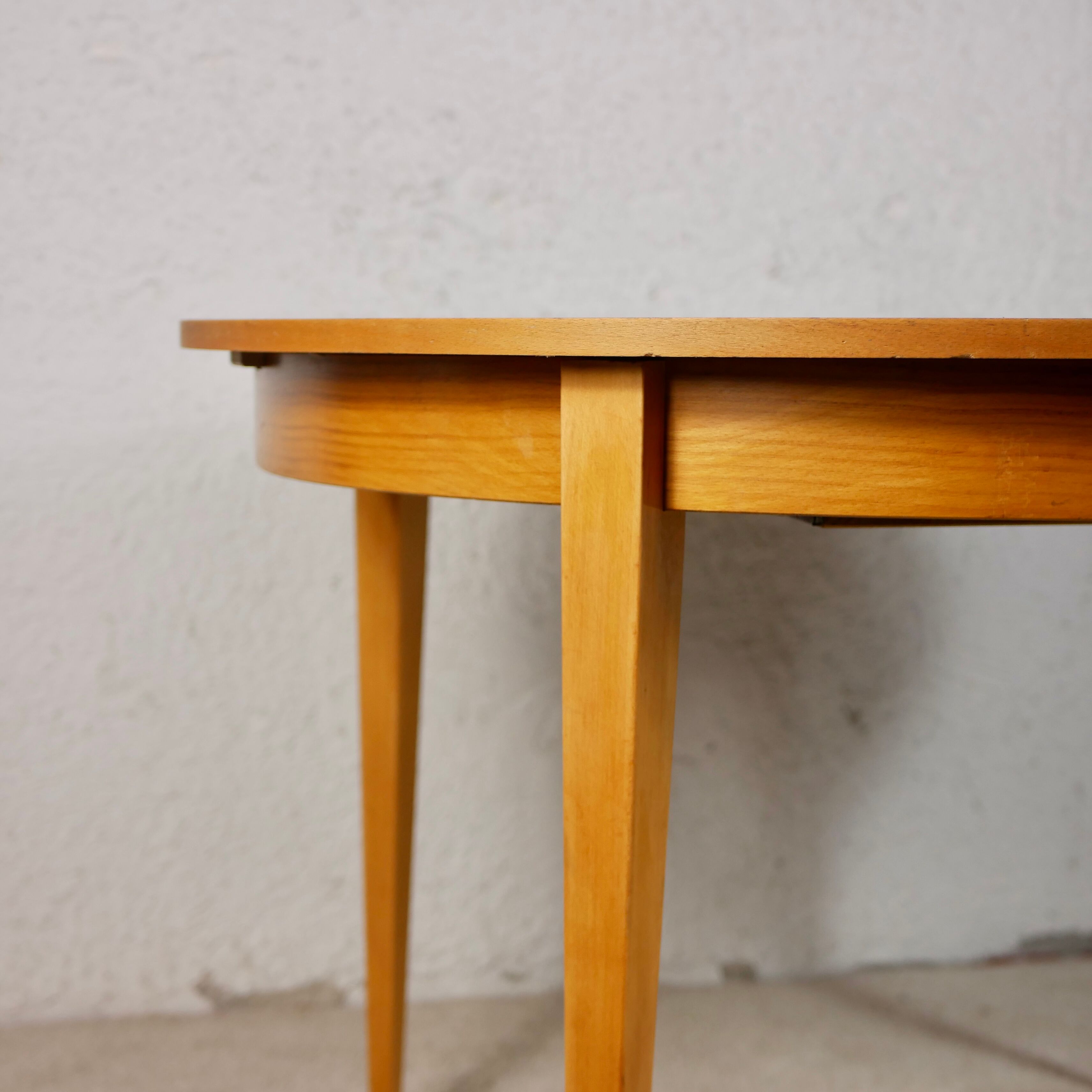 Scandinavian style teak table with butterfly extension