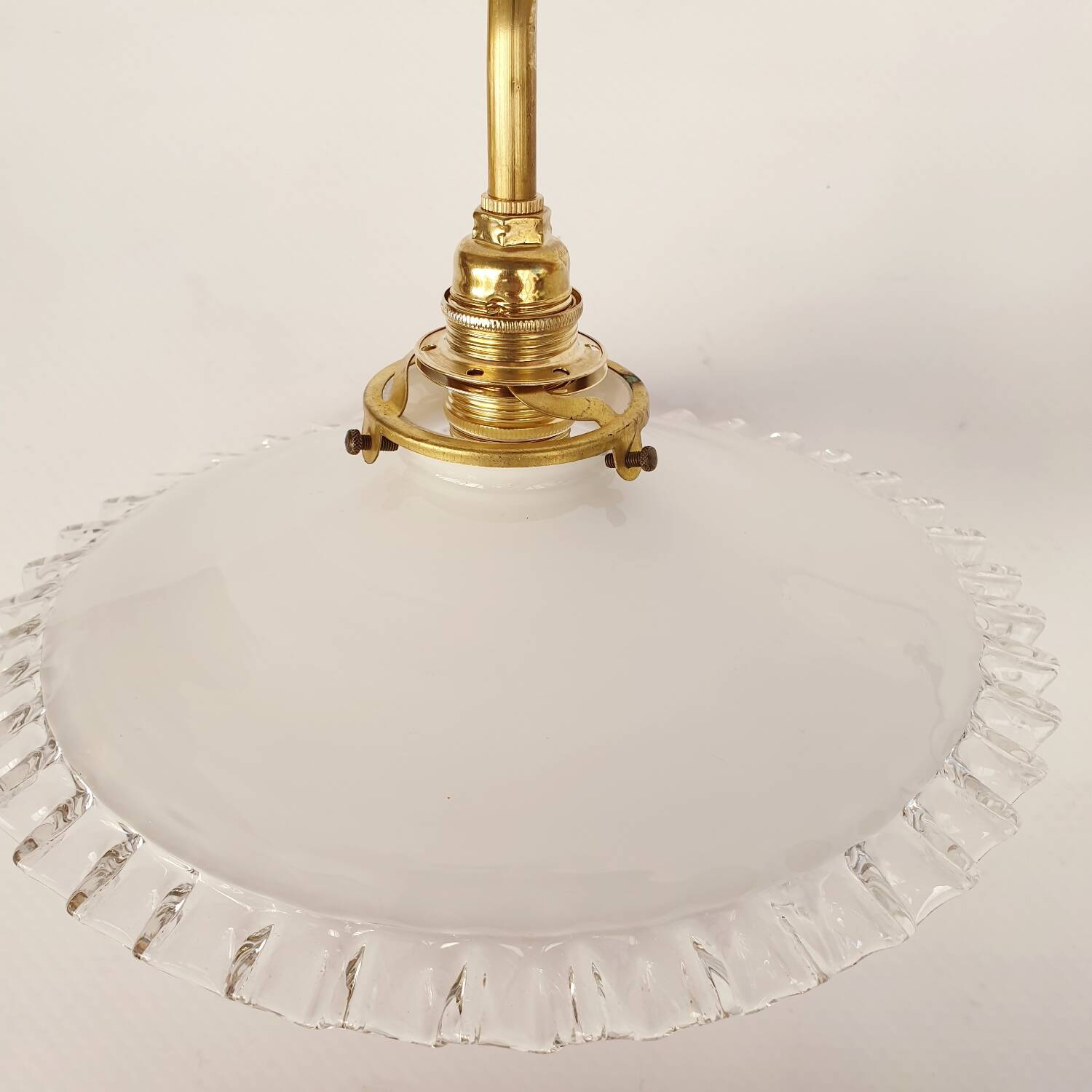 Swan neck sconces in serrated opaline